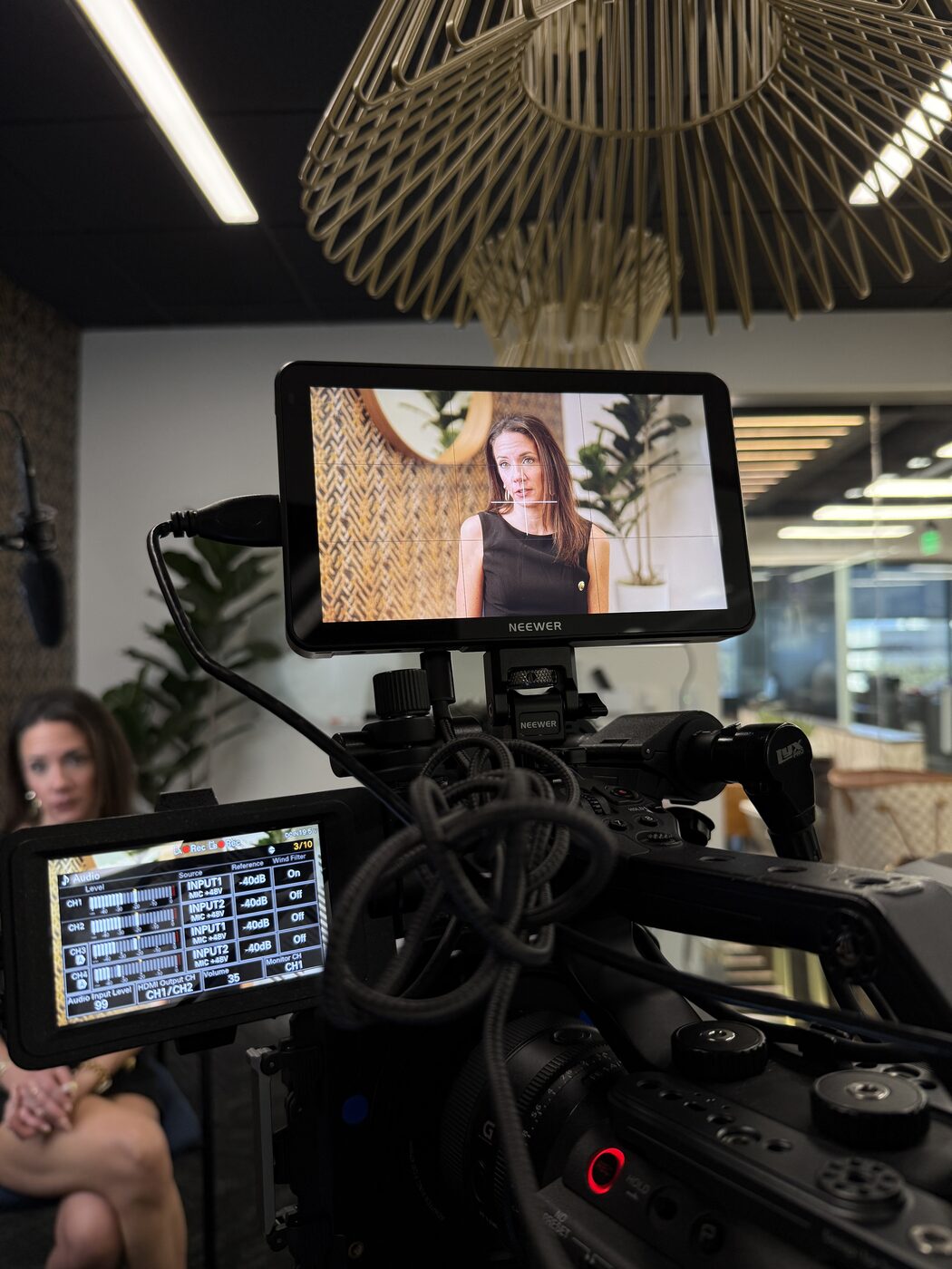 On-set monitor showing an interview subject during a CNB Creative shoot